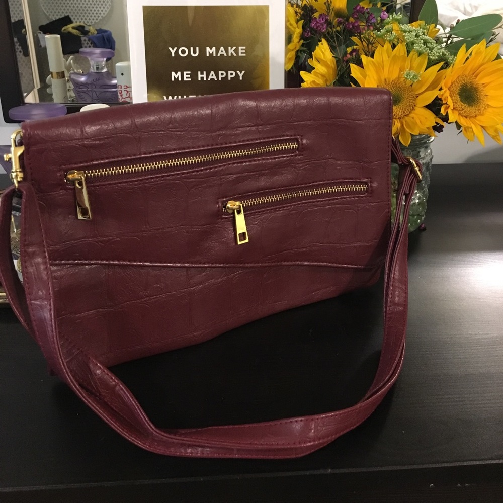 Burgundy clutch/ cross body Mark. bag