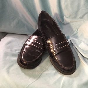 Black shiny loafers with studs