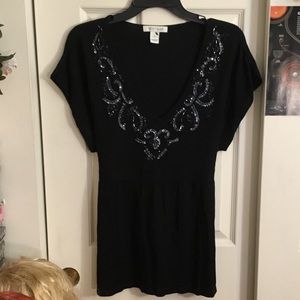 Black v-neck top with beaded neckline