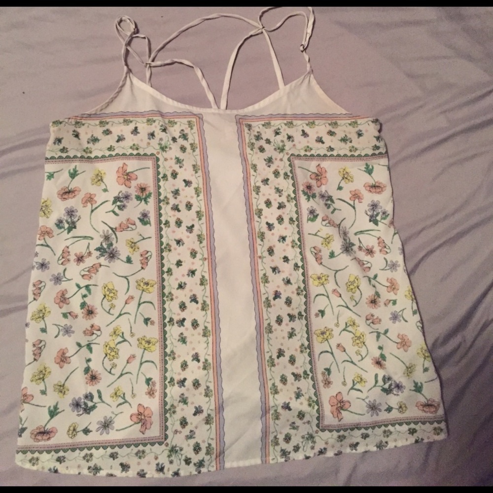 A cute spaghetti strap top that has floral print