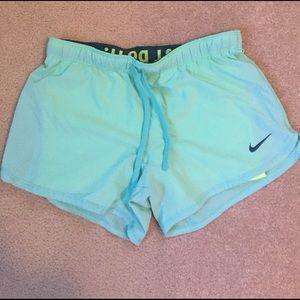Aqua Nike shorts with compression liner