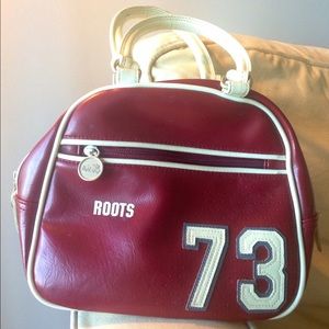 * On hold until Friday * Roots handbag