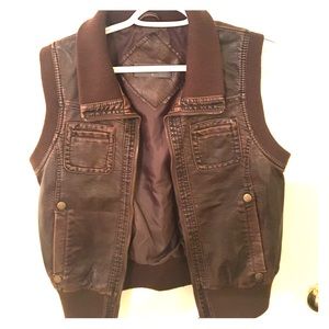 Brown leather motorcycle vest.