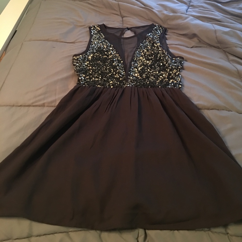 Sequined open back little black dress
