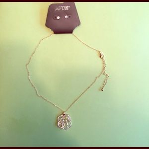 Studded earring and rose necklace