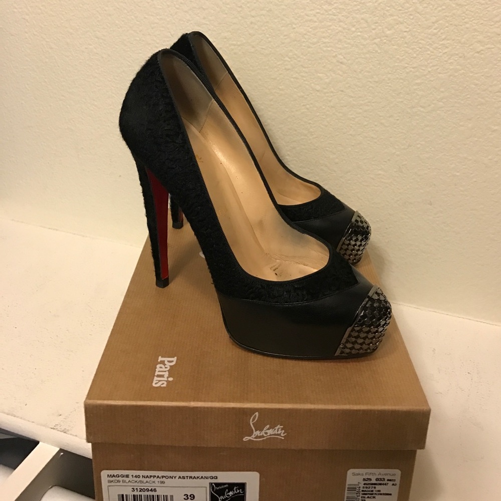 Christian Louboutin black and metal pony pumps.