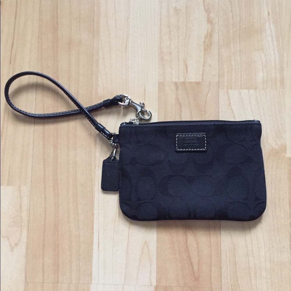 Small black Coach wristlet with Coach signature