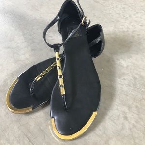 Gold and black sandals