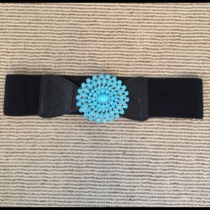 Black elastic belt with large turquoise buckle