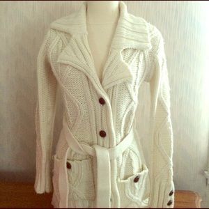 Cream colored sweater with tie waist and buttons