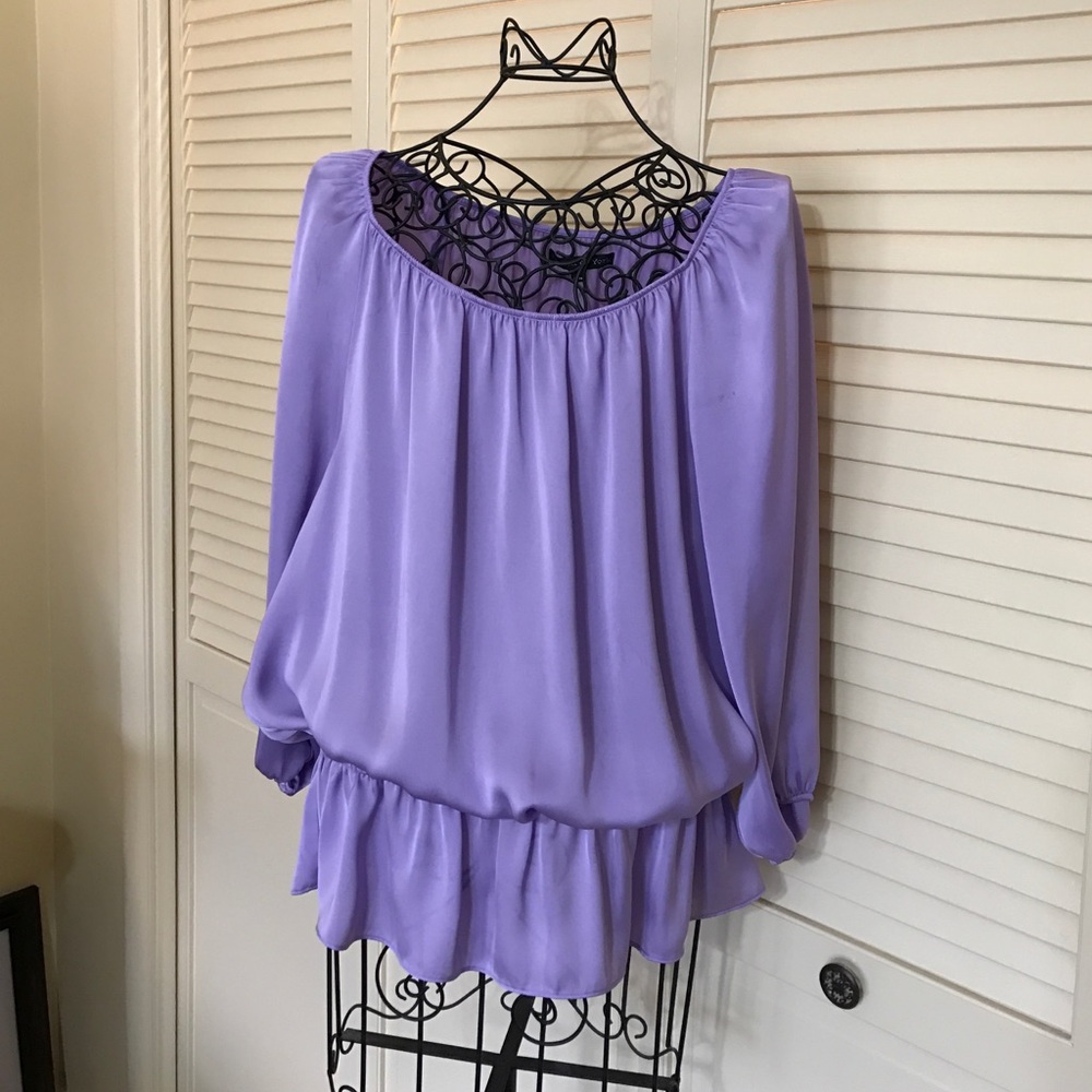 Lavender blouse with elastic peplum waist.