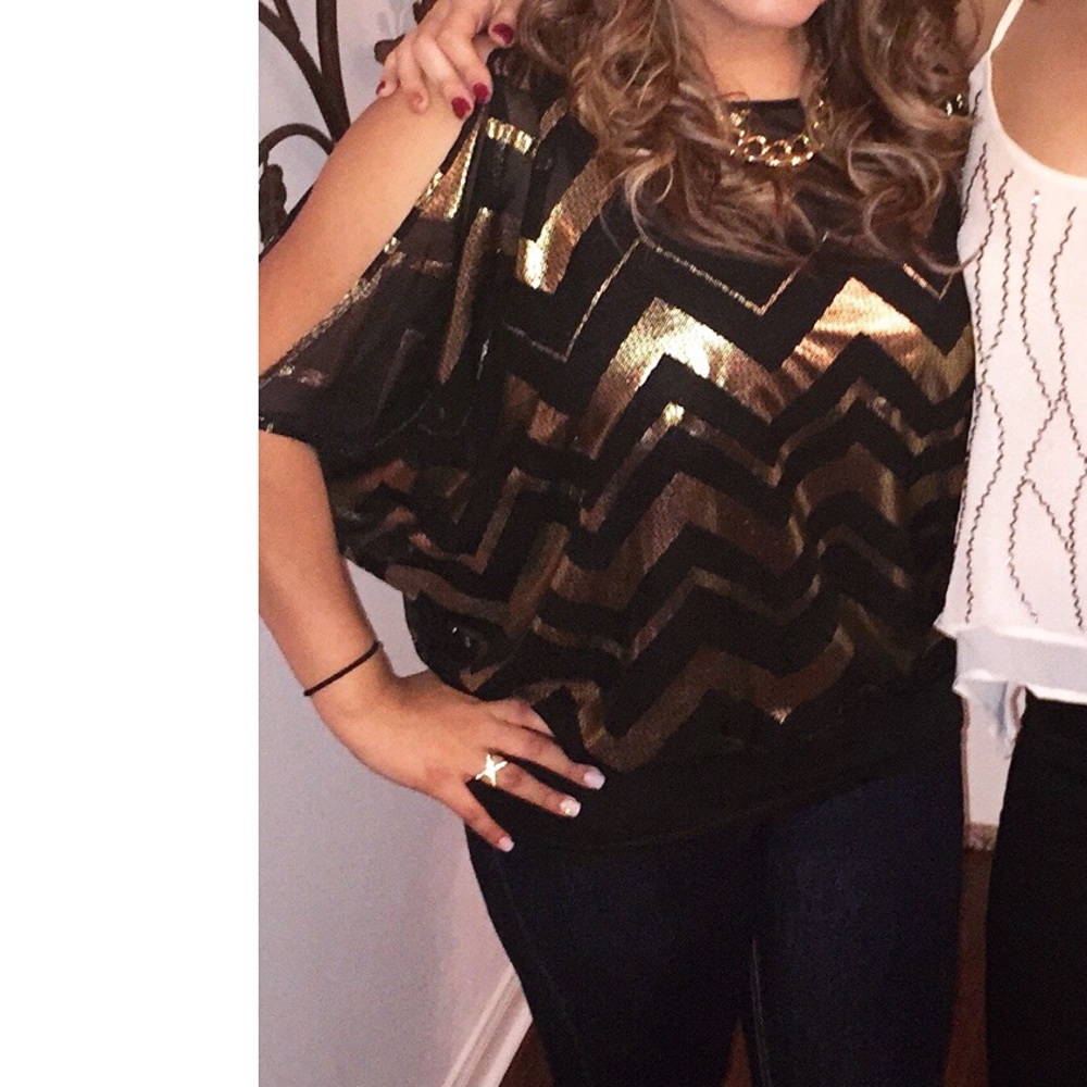 Black and gold batwing top