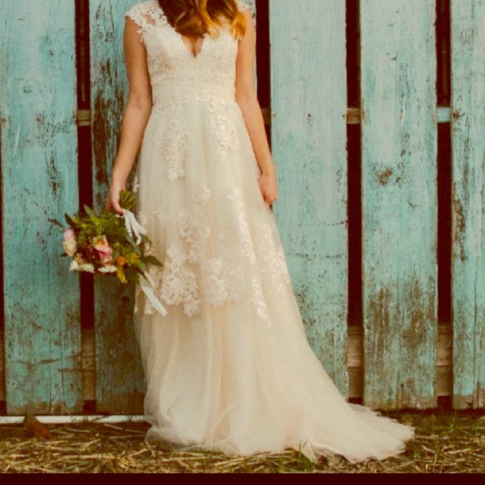 Unworn wedding dress in creamed ivory with blush