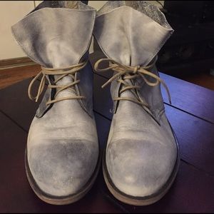Distressed light blue boots