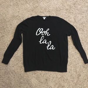 Black sweater w/ the saying "Ooh la la"