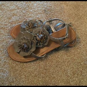 Tan sandals with flowers
