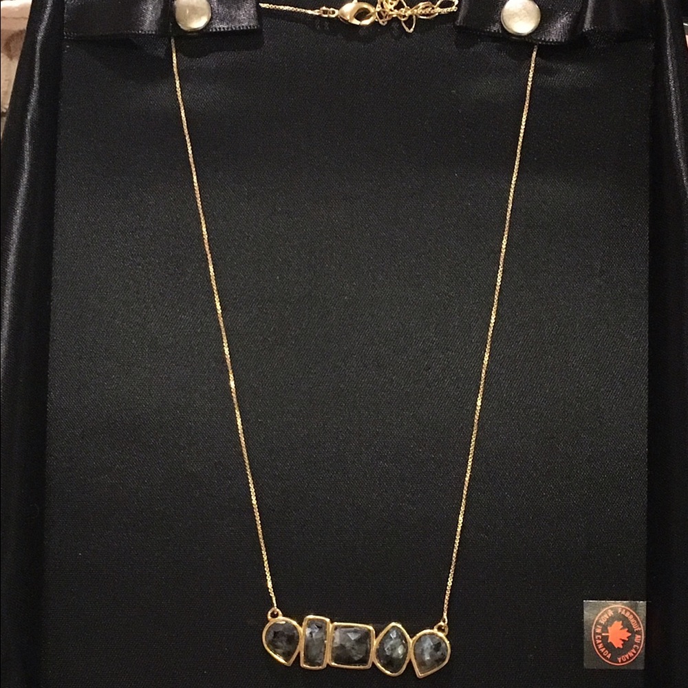 Gold pendant with geometric stones