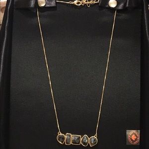 Gold pendant with geometric stones