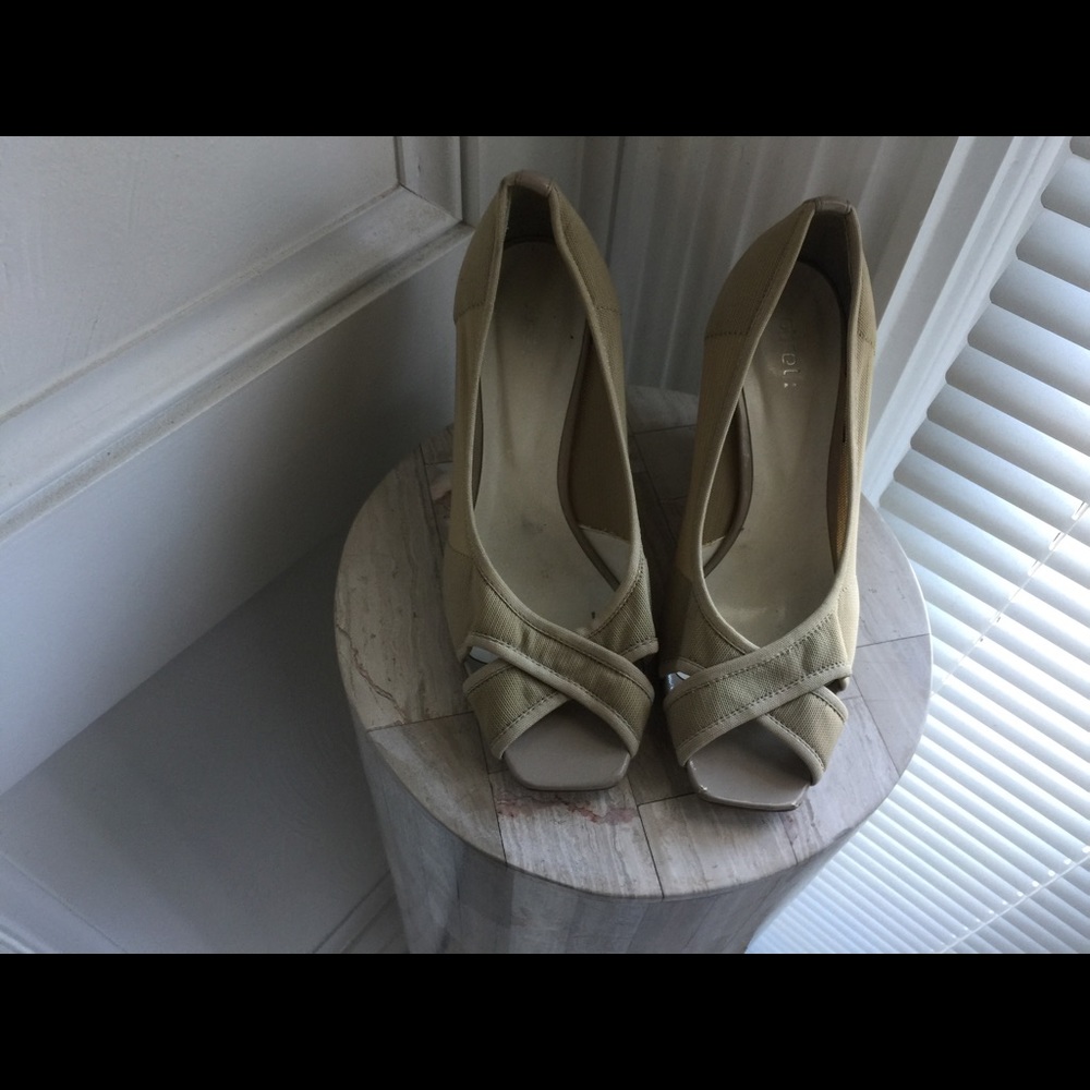 Peep toe tan wedges.