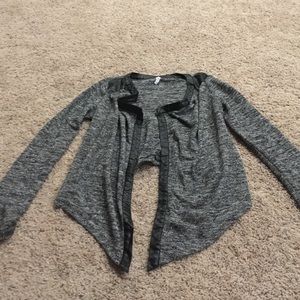 Gray, glittery shark bite style cardigan.