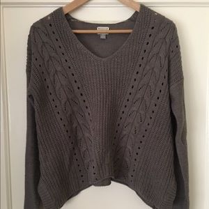 Loose fitting, light brown sweater