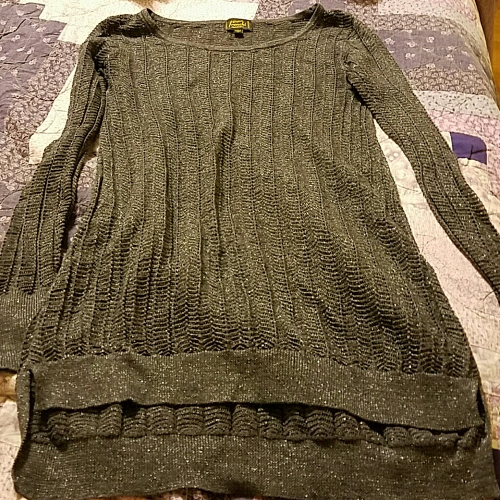 Sparkling tunic-length gray sweater.