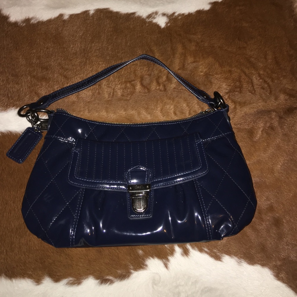 Cute  coach purse can also be worn as a Crossbody.