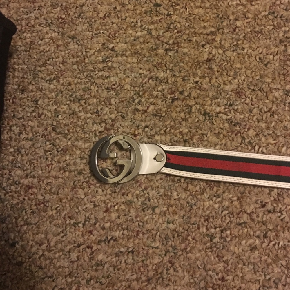 Gucci belt and a Polaroid speaker