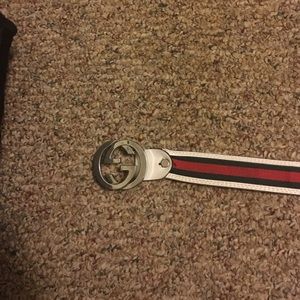 Gucci belt and a Polaroid speaker