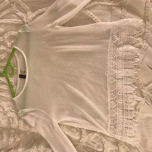 white sweater with an aztec print bottom