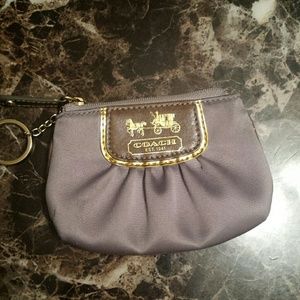 Zip top coin Coach purse.