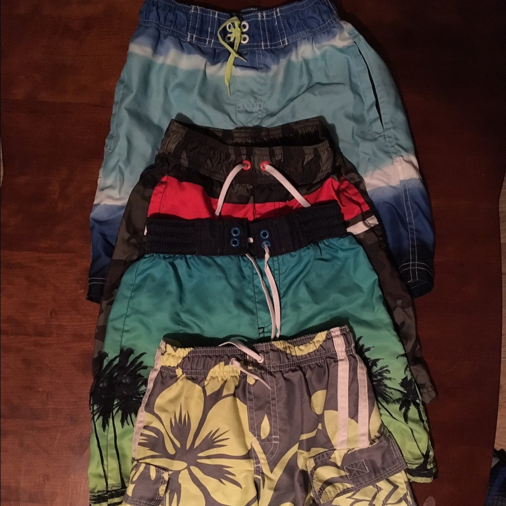 4 swimming trunks (boy size 5/6)