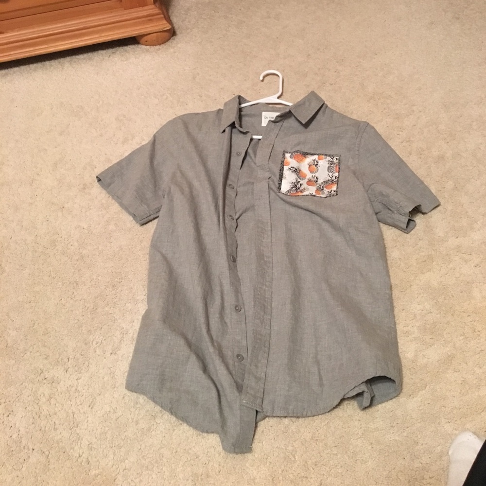 On the byas button down. Once wore. No damage
