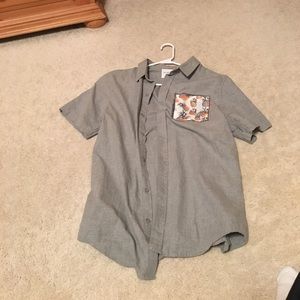 On the byas button down. Once wore. No damage