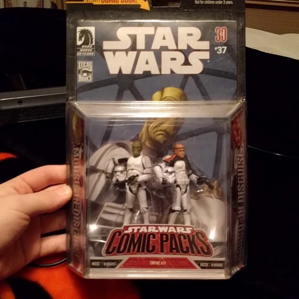 Star wars toy still in package .