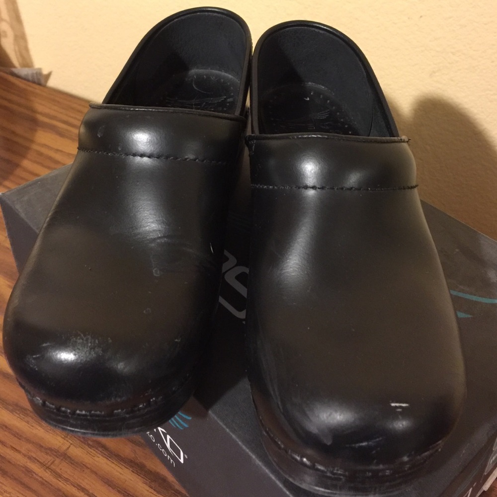 Dansko clogs, little wear. Slight scuff on toes
