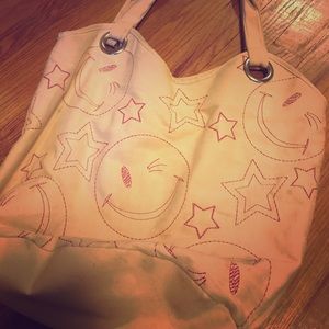 A large smiley face bag
