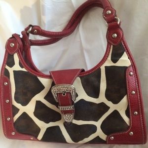 Cow hide print with crystal buckle purse