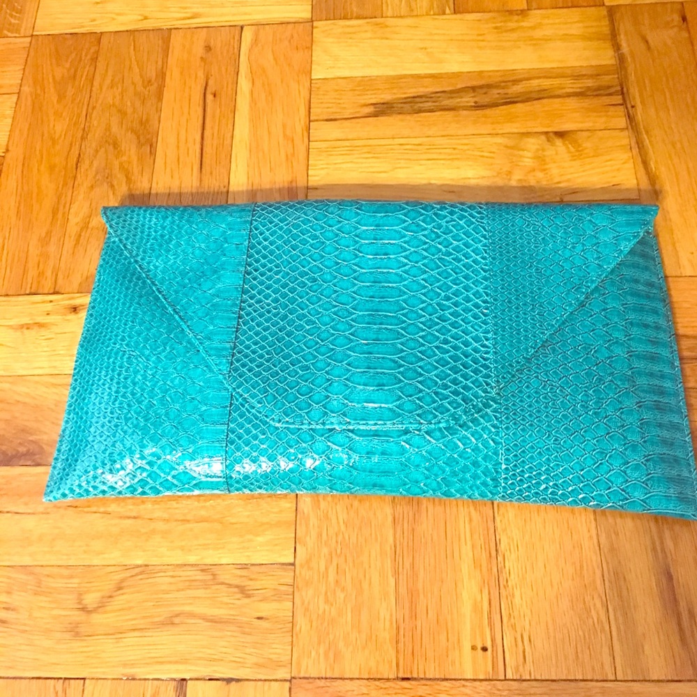 Teal convertible clutch.  Never worn