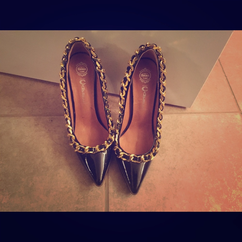 Jeffrey Campbell black and gold pumps.