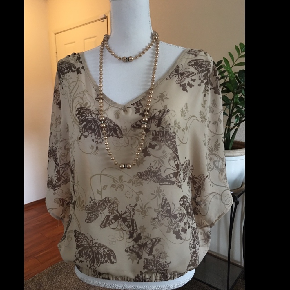 Neutral color blouse.
