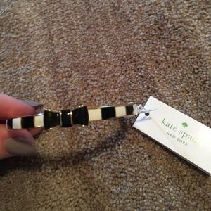 Black and white striped gold Kate spade bangle