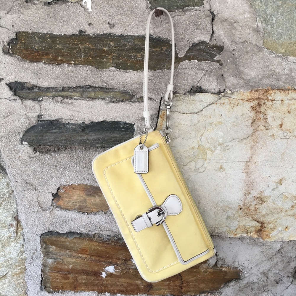 Coach yellow w/ white leather piping wristlet