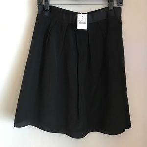 Black flowing knee-length skirt