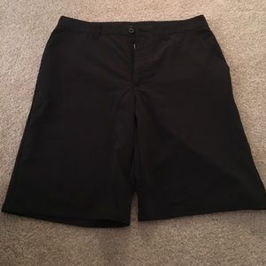 Black Travis Matthew golf shorts