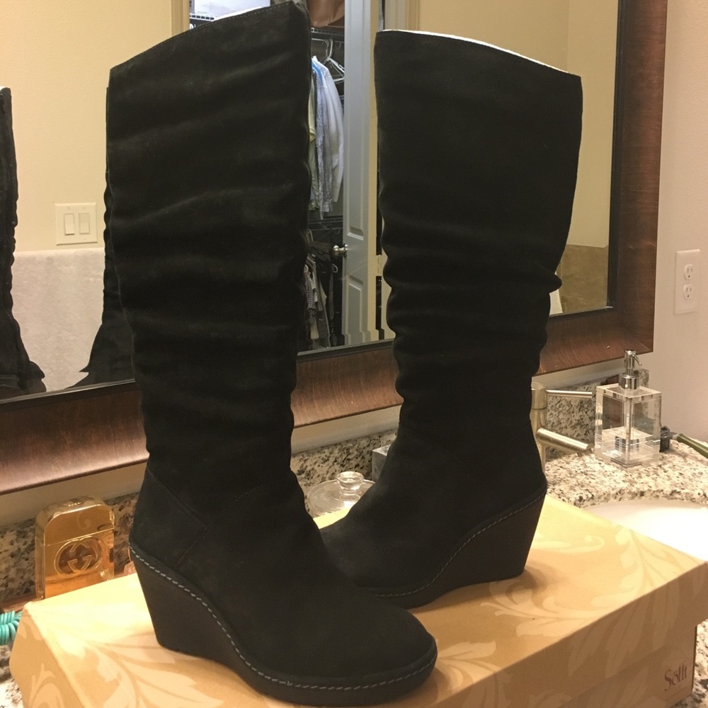Black suede boots with wedge heel