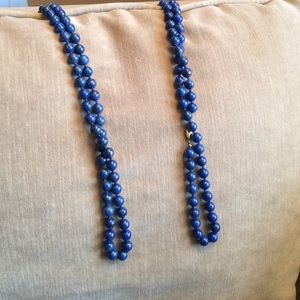 two strands of blue pearl beads
