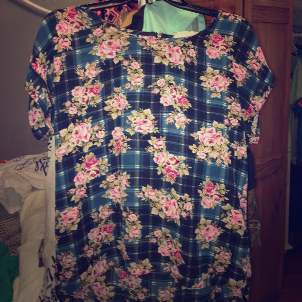 A Greenish plaid shirt with floral patterns