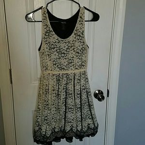 Cream and black lace covered dress