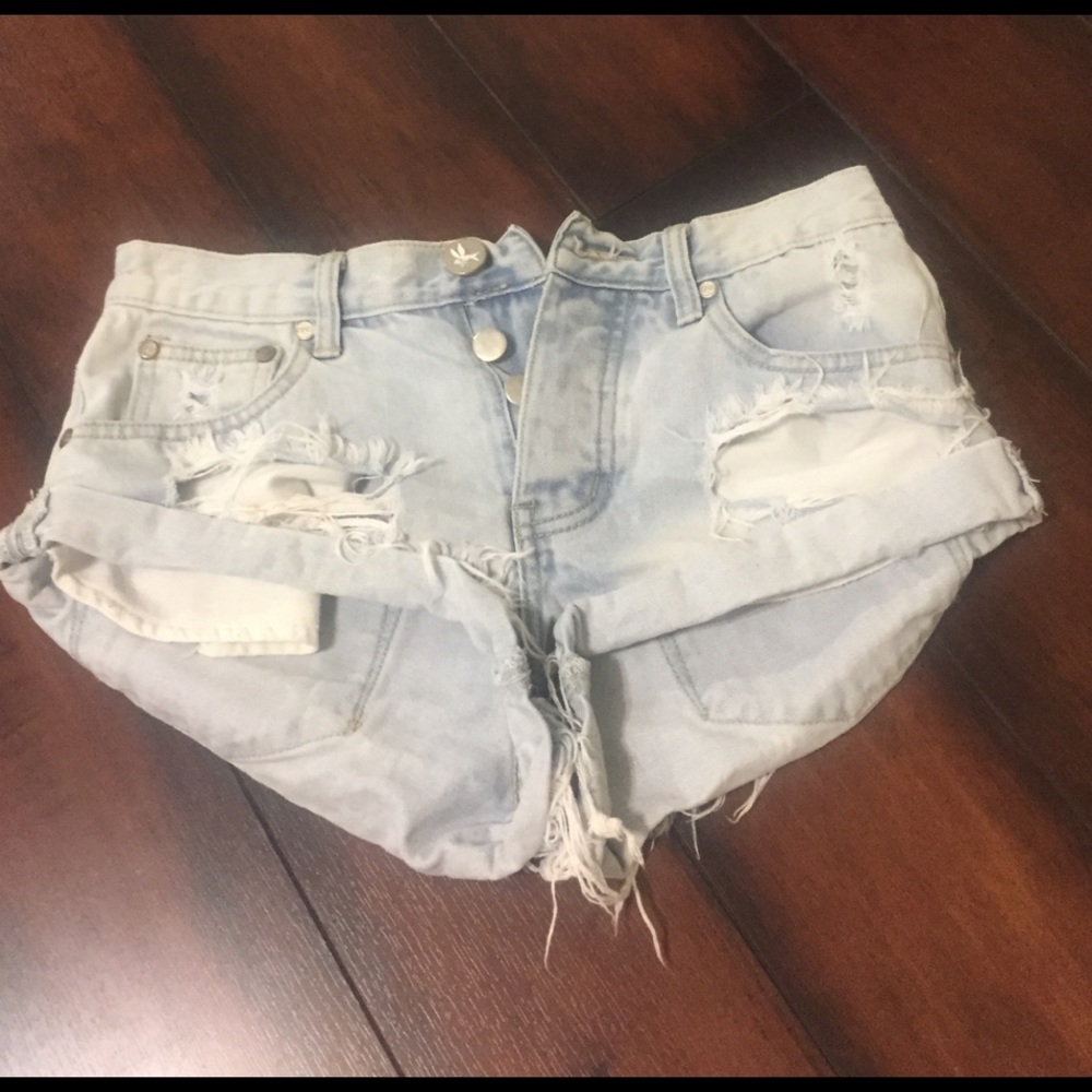 Light denim distressed shorts